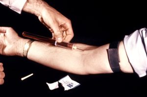 Clinician shown here is obtaining a blood sample